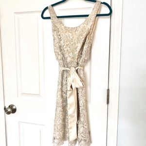 Lace and sequin cocktail dress: satin bow